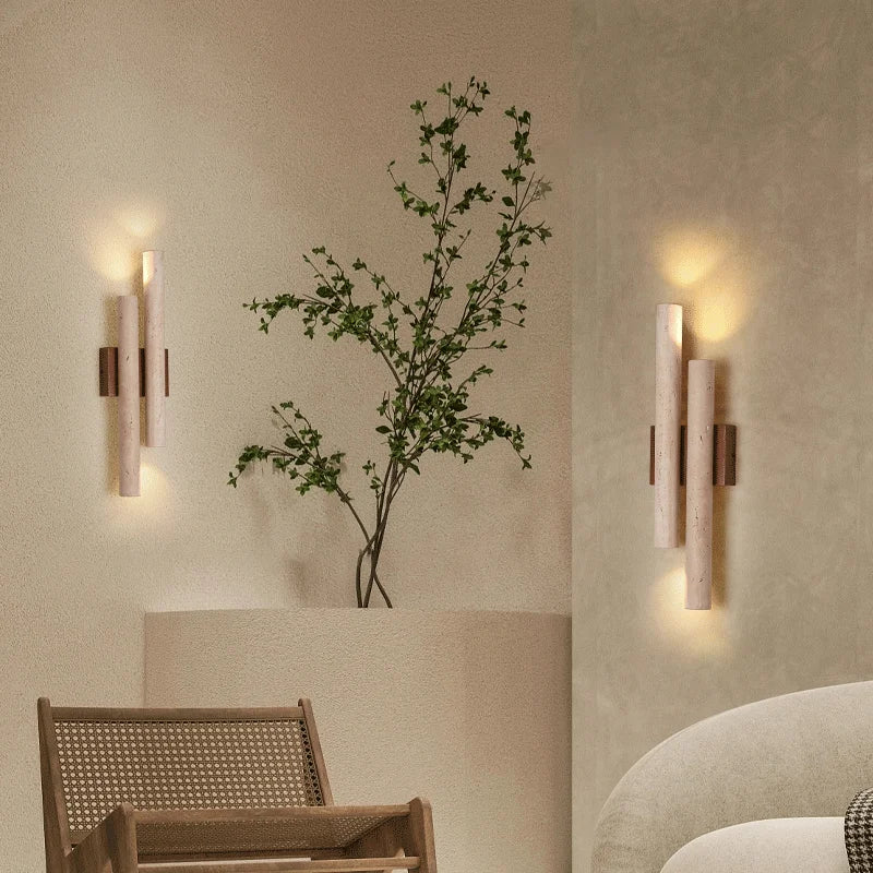 Travertine stone wall lamps with wood accents mounted in a minimalist room, enhancing decor with soft LED ambient lighting.