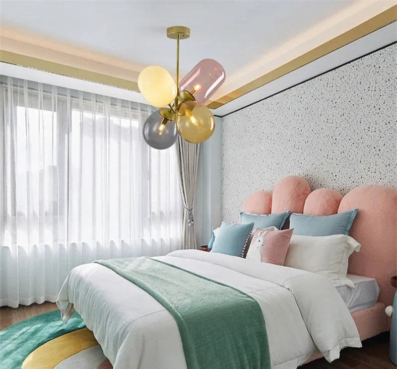 Stained glass branch chandelier hanging in a pastel-themed children's bedroom, adding artistic LED lighting and elegance to the space.