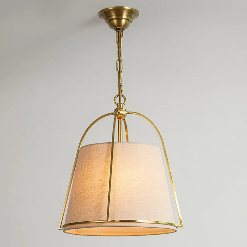 Close-up of postmodern chandelier LED pendant with gold metal frame and soft fabric shade, designed for stylish home lighting.