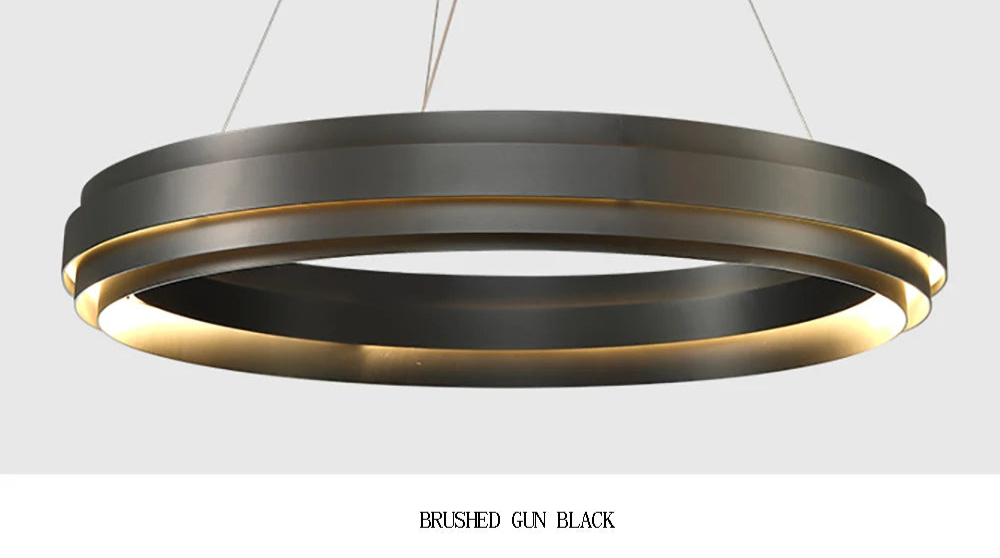 Brushed gun black LED ring chandelier with soft lighting, perfect for modern bedrooms or dining areas.