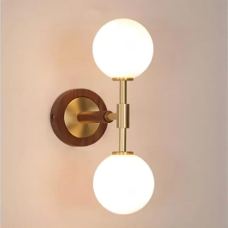 Modern copper bedroom sconce with warm lighting, mounted on a soft-toned wall for cozy ambiance.
