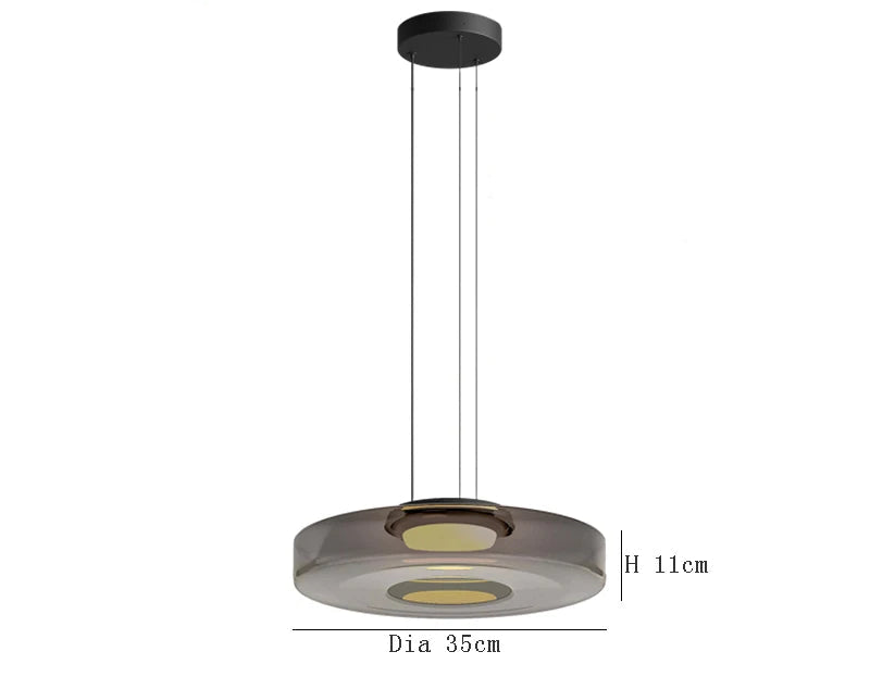 Smoke grey glass pendant light with 35cm diameter and 11cm height. LED source and adjustable wire for kitchen or dining decor.