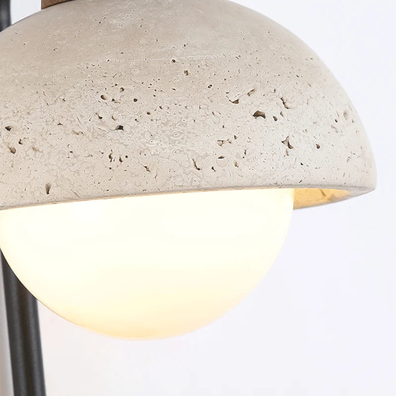 Close-up of Travertine Wall Lamp's natural stone shade, showcasing its textured surface and soft LED glow.