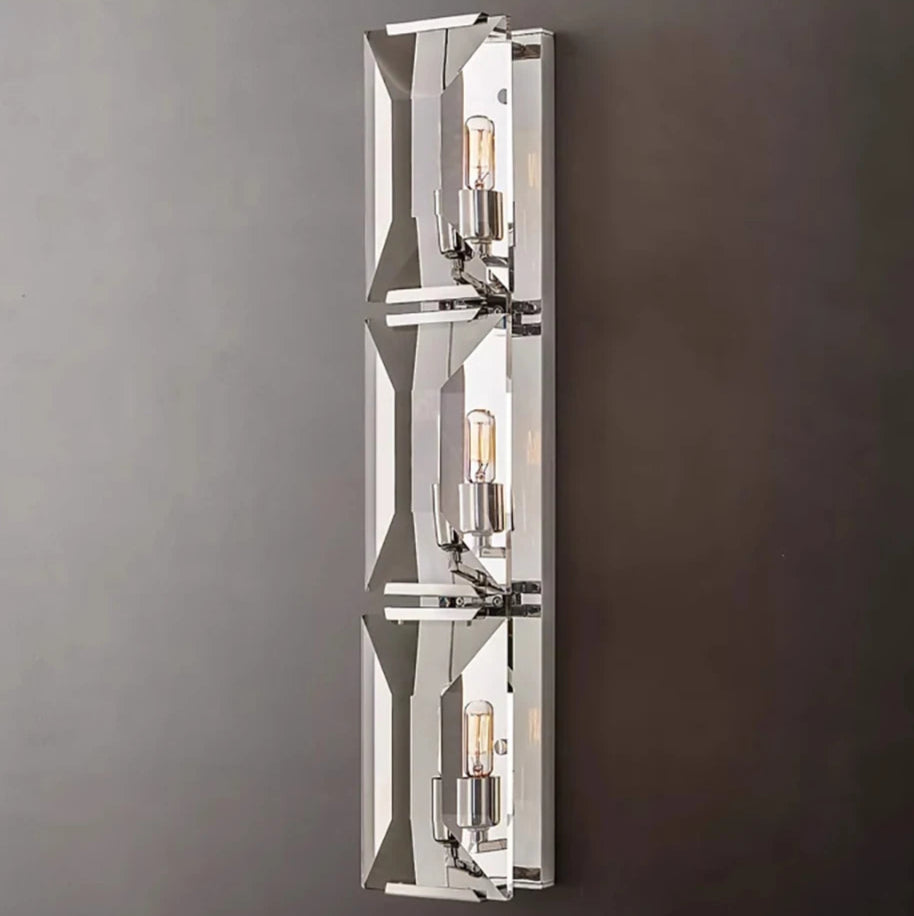 Triple crystal LED wall sconce in silver finish, featuring exposed bulbs and reflective surfaces for modern lighting decor.
