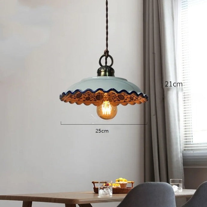 Farmhouse-style ceramic pendant light with scalloped edge and LED bulb, 25cm wide and 21cm tall, perfect for dining rooms.