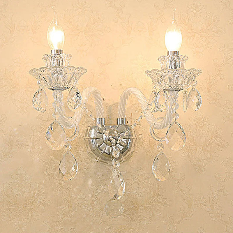 Illuminated vintage lotus crystal wall lamp with clear crystals and LED bulbs, enhancing French-style interior ambiance.