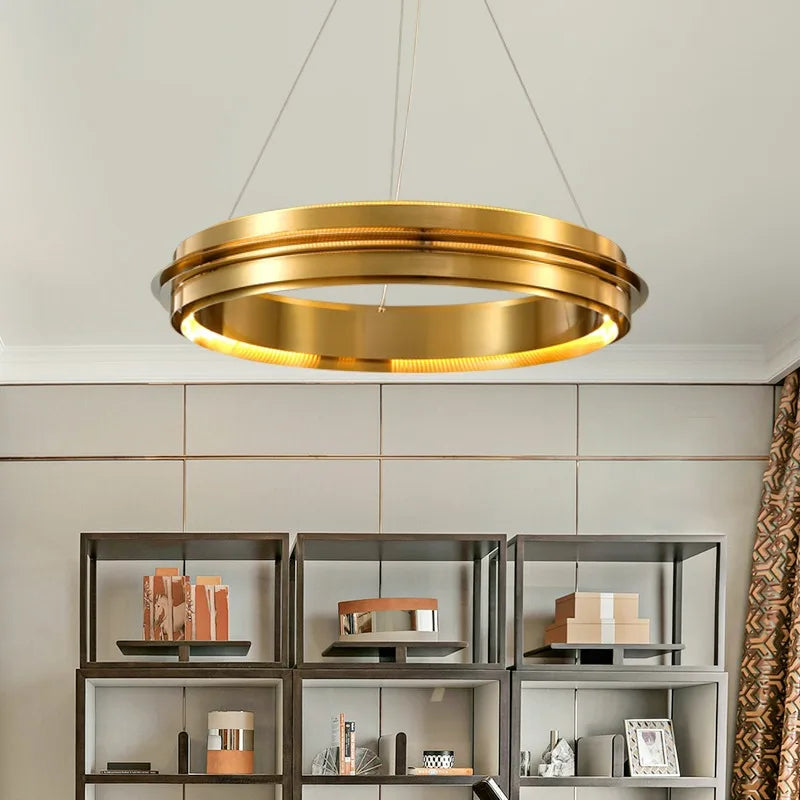 Modern gold ring chandelier with LED lighting, ideal for stylish living rooms or study areas with open shelving.