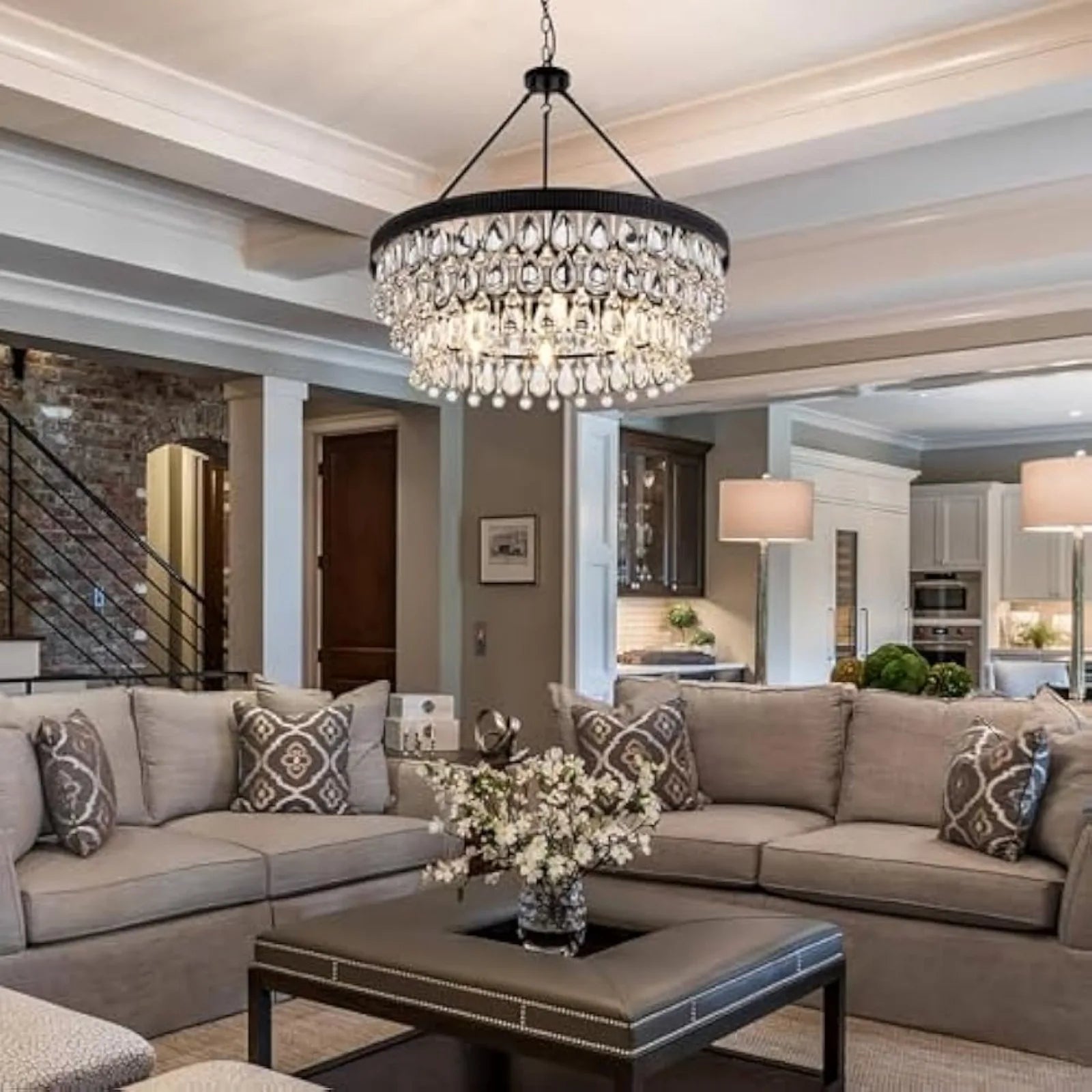 Modern crystal chandelier installed in a villa-style living room, enhancing the space with elegant lighting and luxurious ambiance.