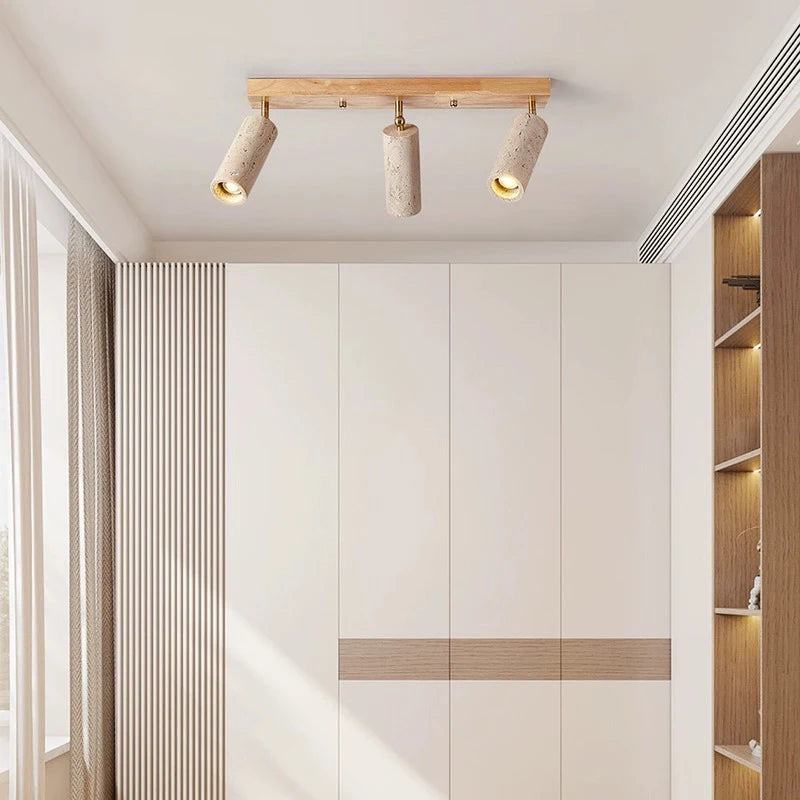 Modern ceiling light with stone spotlights and wood base installed in a minimalist bedroom, ideal for ambient and directional lighting.