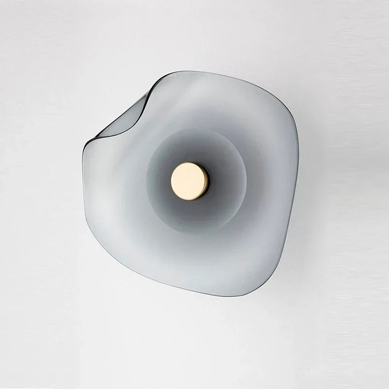 Modern creative design glass wall lamp in soft grey tone with round art deco style, perfect for minimalist home lighting decor.
