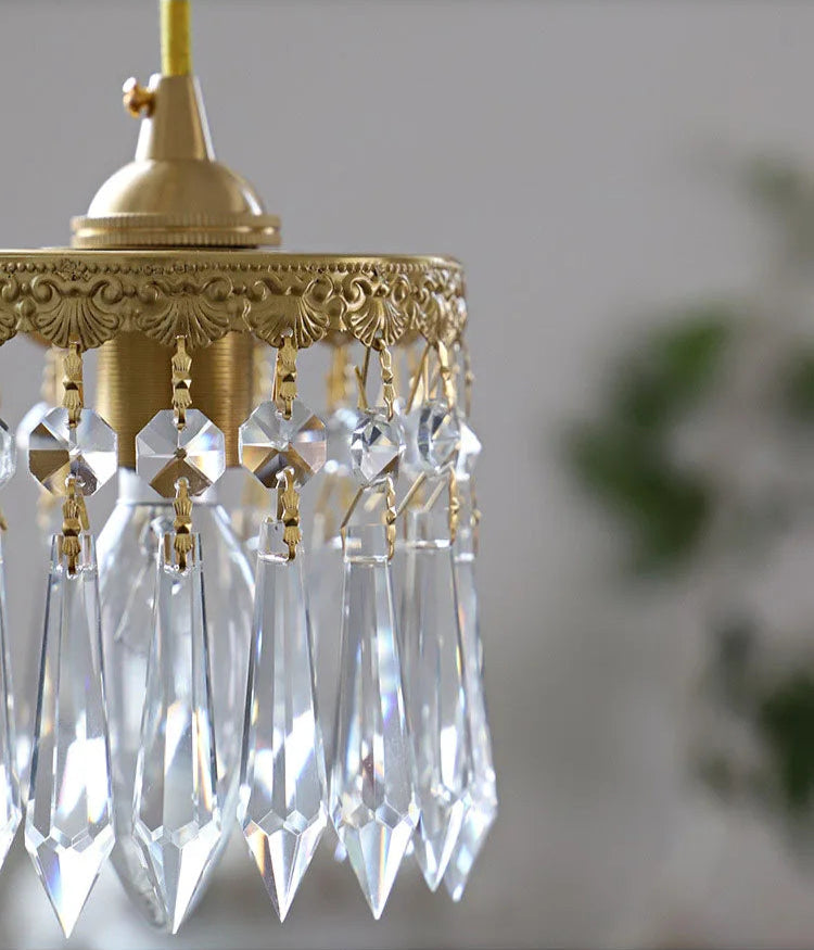 Bottom view of copper angel chandelier light with glowing LED and crystal drops, ideal for ambient lighting.