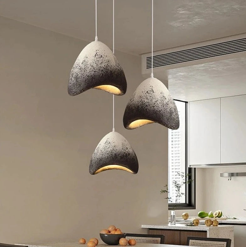 Gradient black and white dome-shaped pendant lights in a kitchen, featuring Nordic wabi-sabi design and soft LED illumination.