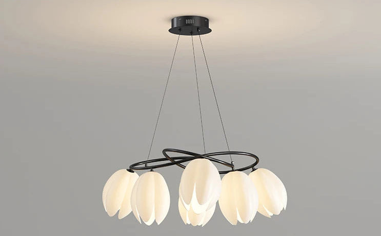 French Magnolia LED Chandelier turned on with cream petal lights and black frame, ideal for floral-inspired ceiling lighting.
