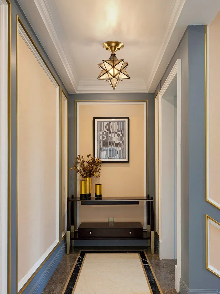 Geometric copper ceiling light in a luxury hallway, offering sophisticated lighting with a modern flush mount design.