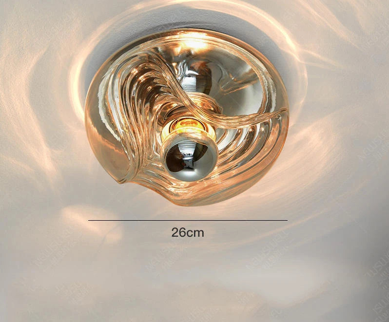 Cognac-colored designer glass wall lamp with LED light, 26cm wide, ideal for warm-toned modern interiors.