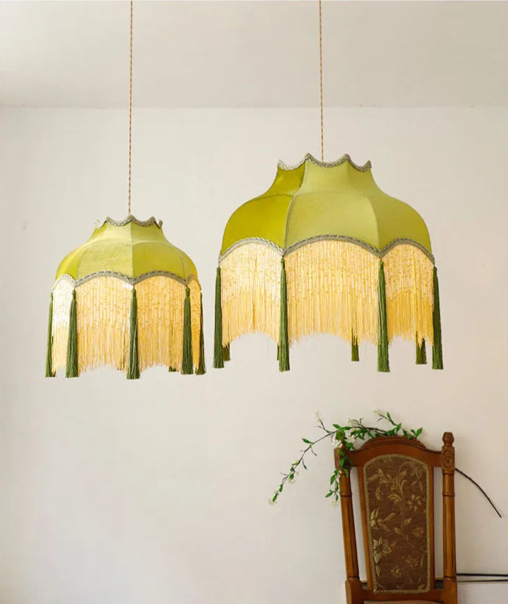 Pair of green velvet tassel chandeliers in different sizes, perfect for coordinated vintage lighting in home decor.