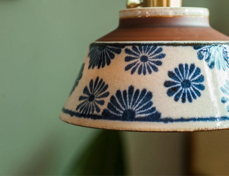 Detailed view of ceramic shade on Retro Chinese Pendant Light. Blue floral glaze adds artisanal charm to ceiling lighting.