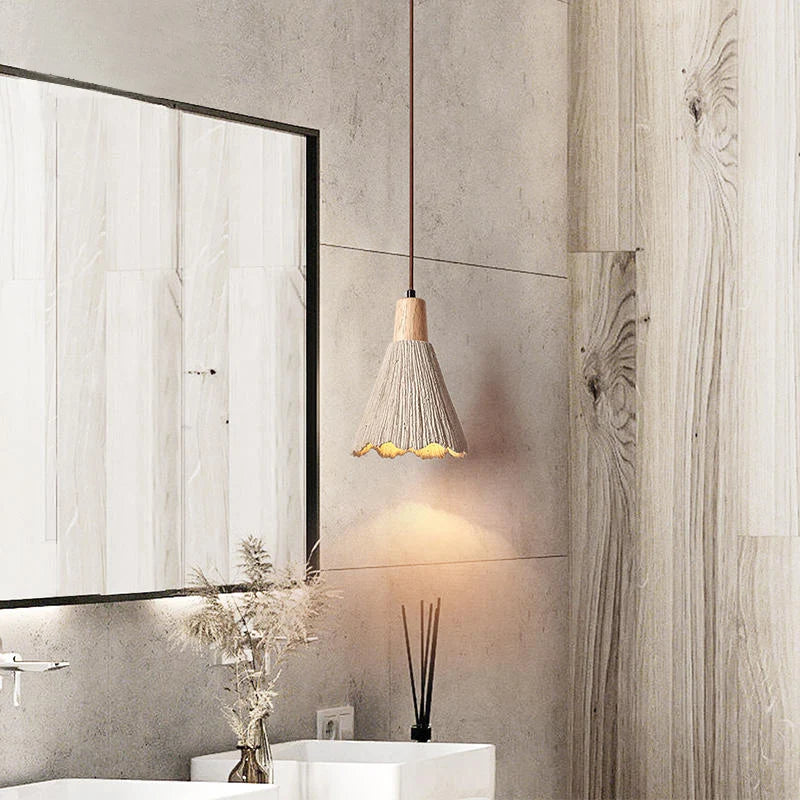 Slim travertine pendant light in bathroom setting, offering elegant vertical lighting with wabi-sabi inspired design.