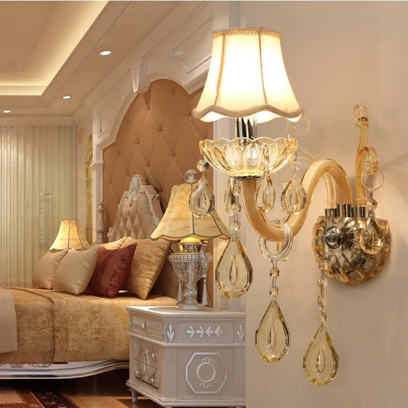LED Glass Sconce - Modern Crystal Wall Lamp mounted beside a bed, showcasing ambient lighting and upscale bedroom interior design.