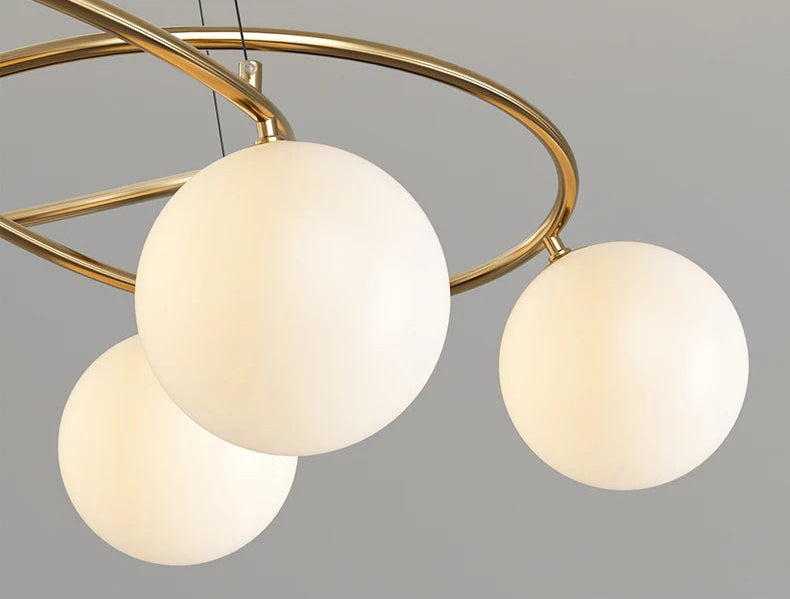 Detailed view of gold frame LED Chandelier with spherical bulbs, showcasing elegant modern ceiling light design.