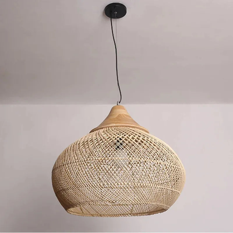 Natural rattan pendant light with wooden top, showcasing a wide dome shape ideal for minimalist or Scandinavian ceiling lighting.
