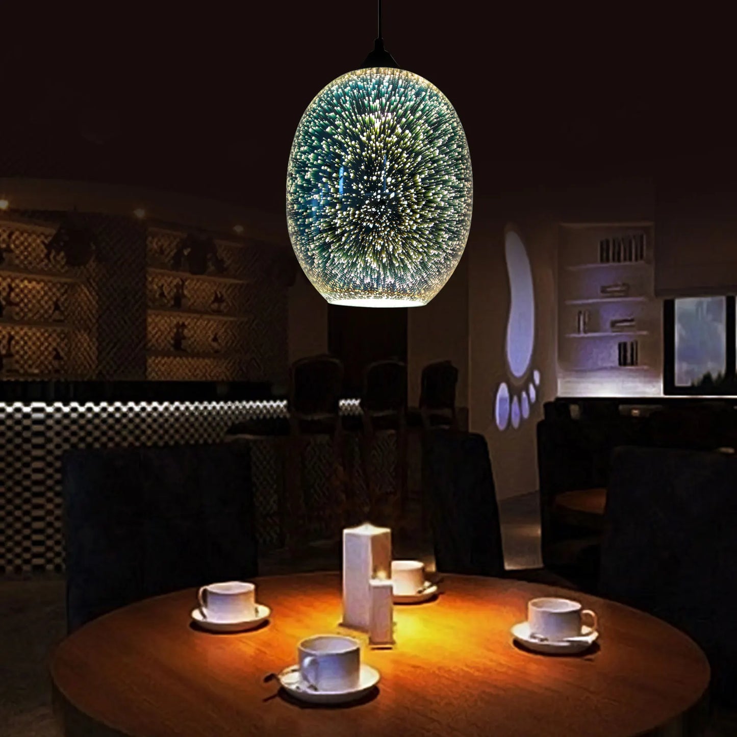 Modern 3D fireworks effect pendant light hanging above a round dining table, casting a warm and stylish glow in a dark setting.