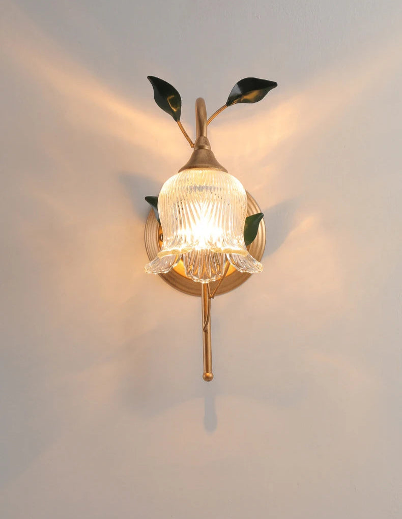 Front view of French Wall Sconce Light with glowing LED bulb, golden stem, and green leaves, ideal for classic wall lighting.