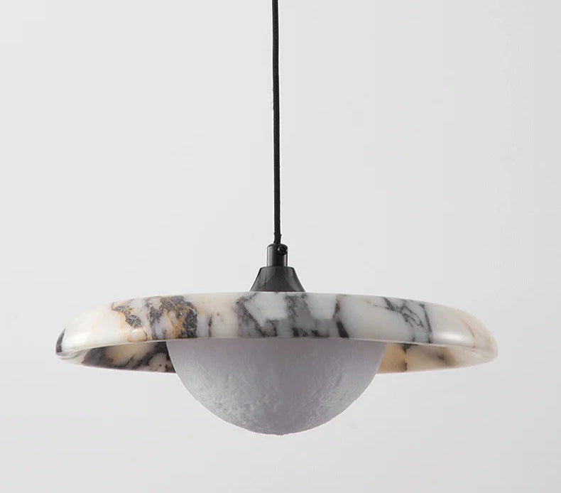 Matte Marble Pendant Lamp shown in on and off states, highlighting the black round marble design and LED light effect.