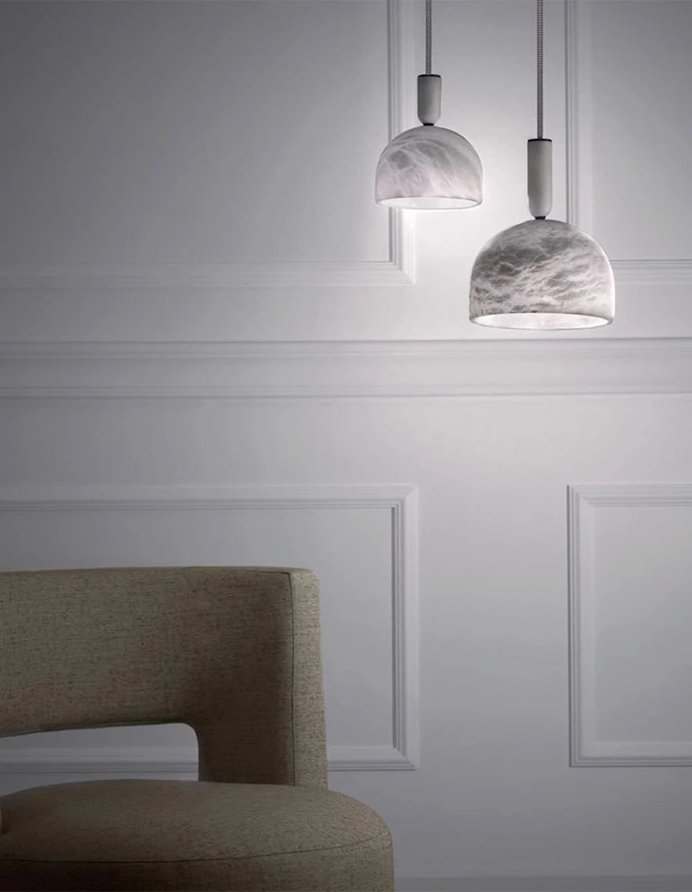 Two dome-shaped marble LED pendant lights in a minimalist room. Marble LED pendant light – modern ceiling lamp dimmable for modern interiors.
