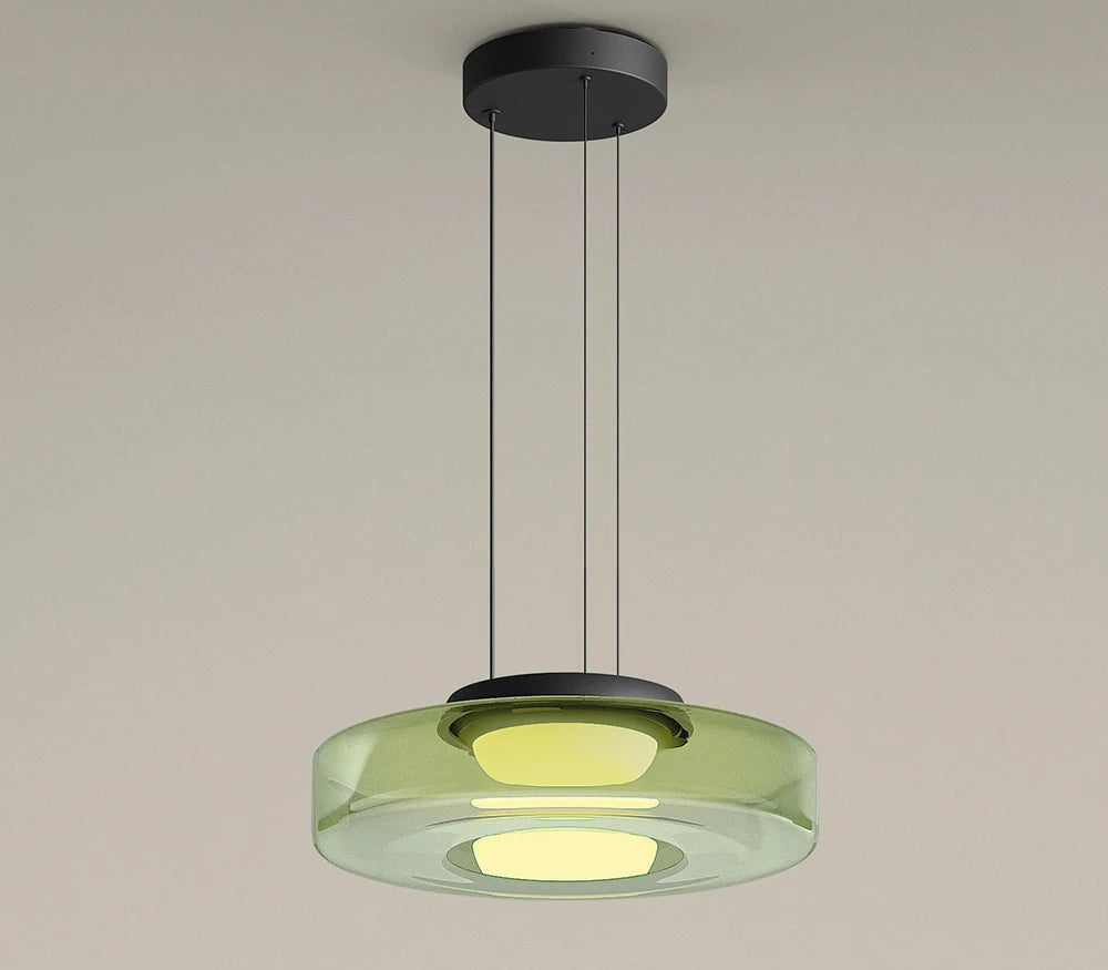 Green single-tier glass pendant light with 45cm diameter. LED lighting and adjustable hanging wire for modern interiors.