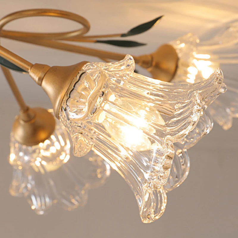 Close-up of decorative glass flower head on French Floral Ceiling Light, showcasing intricate petal detailing and warm LED glow.