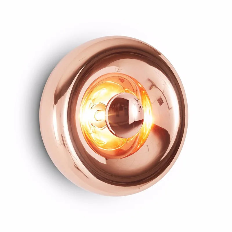 Copper-toned art deco lava wall lamp with glowing LED, stylish for bedroom or dining room wall lighting.