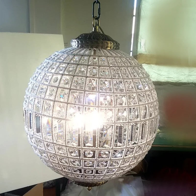 Brightly lit Retro Crystal Chandelier with LED bulbs, featuring a spherical crystal grid design for elegant interiors.