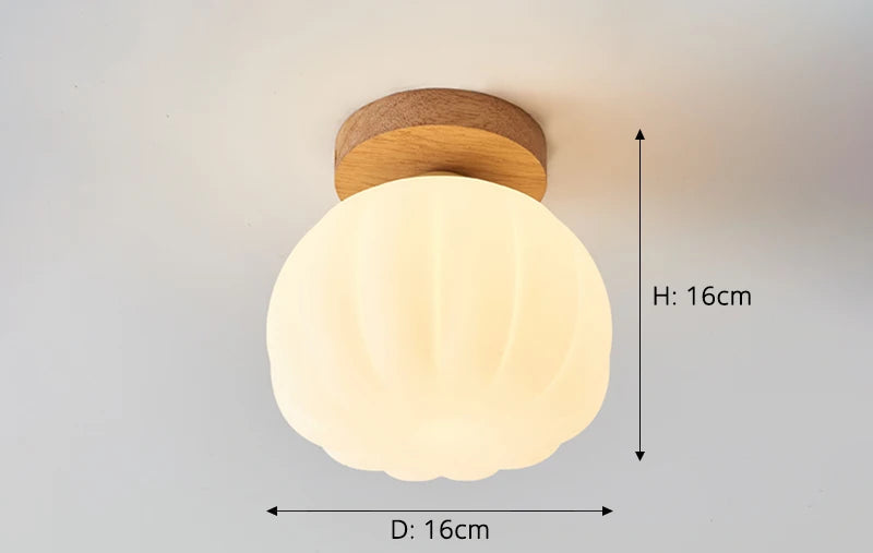 Small LED ceiling light with scalloped glass shade, ideal for compact spaces of 5-8m², using G9 bulb for soft illumination.