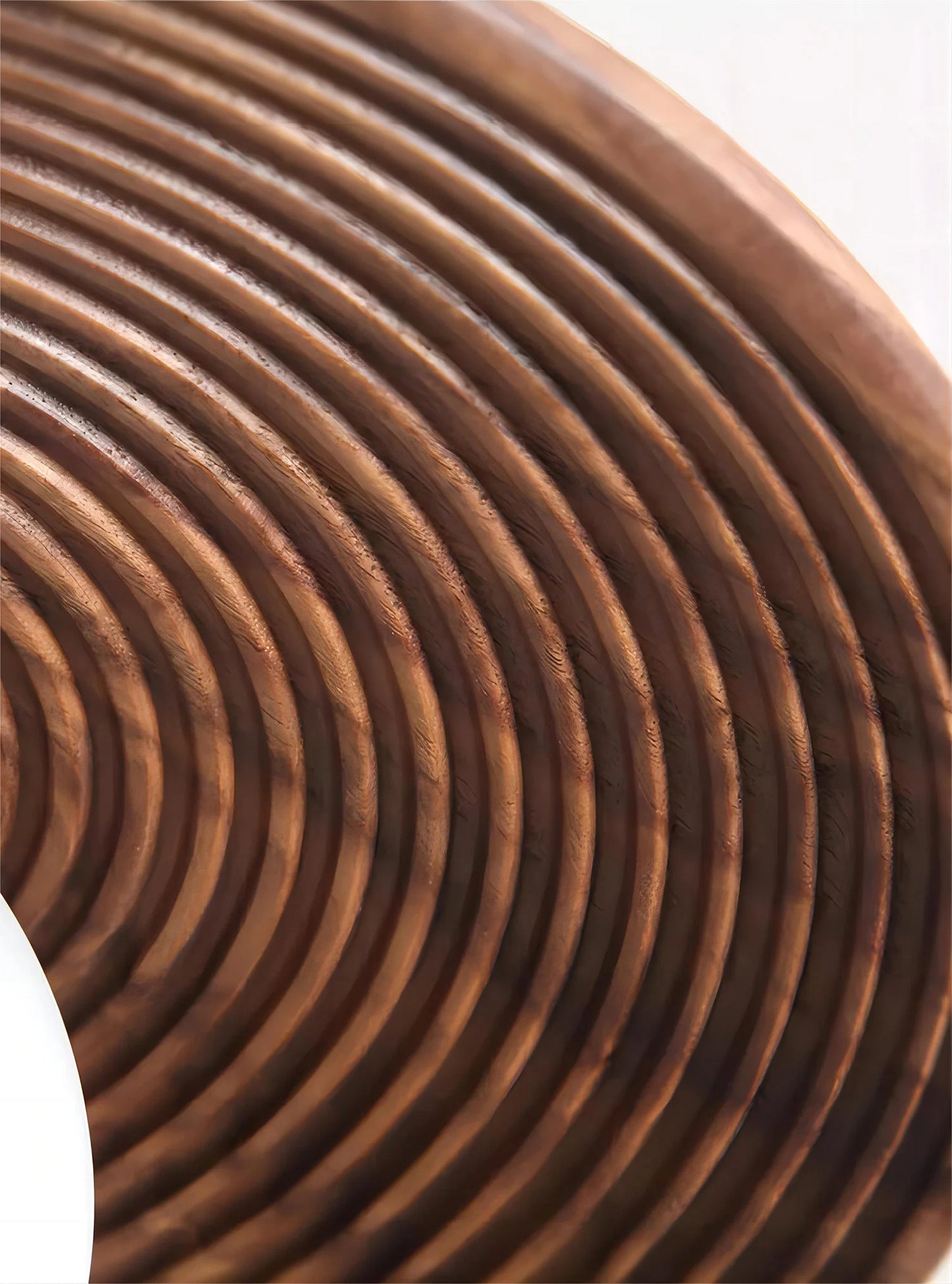 Detailed view of carved walnut wood rings on the LUXELY ceiling light, showcasing craftsmanship and natural texture.