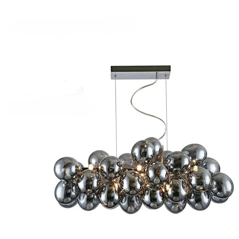 Horizontal modern grape glass chandelier with chrome smoked bulbs, designed for kitchen islands or dining tables.
