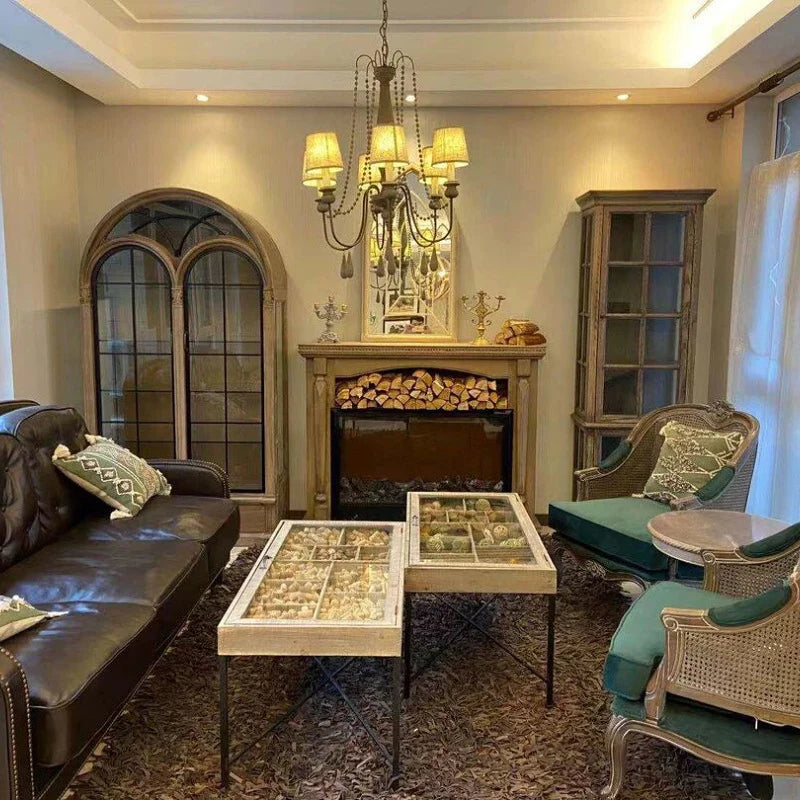 Retro Princess Chandelier installed in a vintage-style living room, showcasing its warm lighting and rustic charm in a cozy home setting.