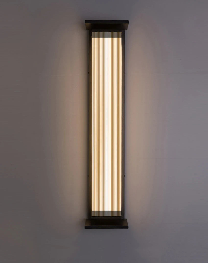 Warm white stainless steel outdoor wall lamp with ribbed design, waterproof and ideal for patios and gardens.