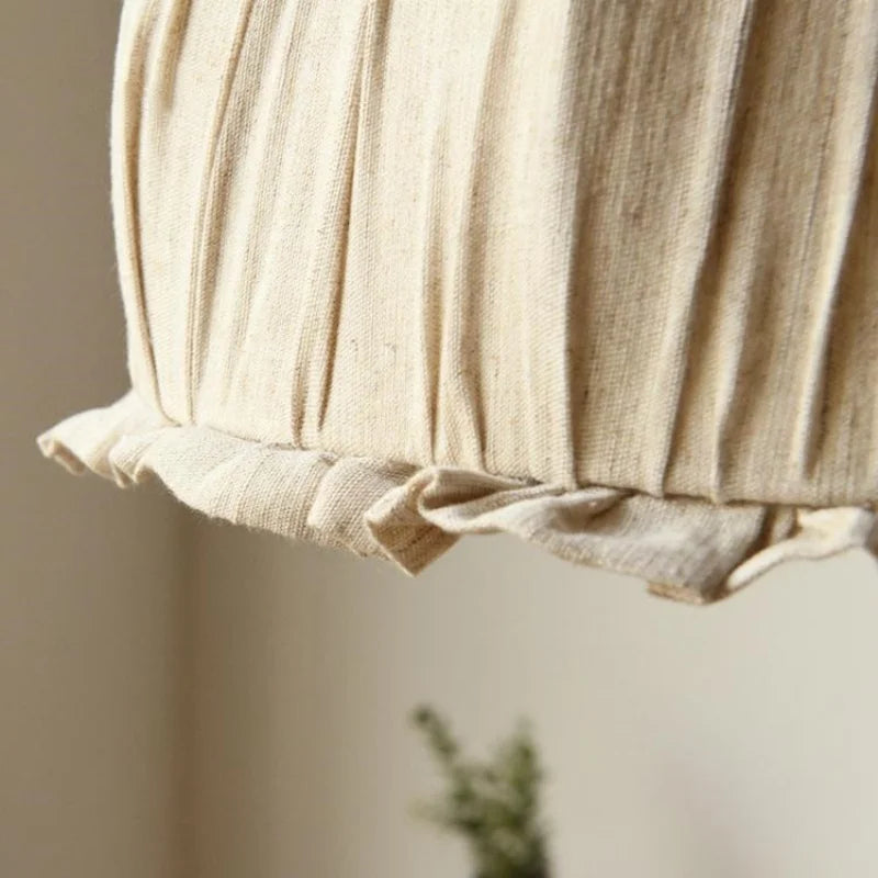 Detailed view of ruffled fabric edge on Japanese pendant lamp, emphasizing its soft texture and elegant finish.