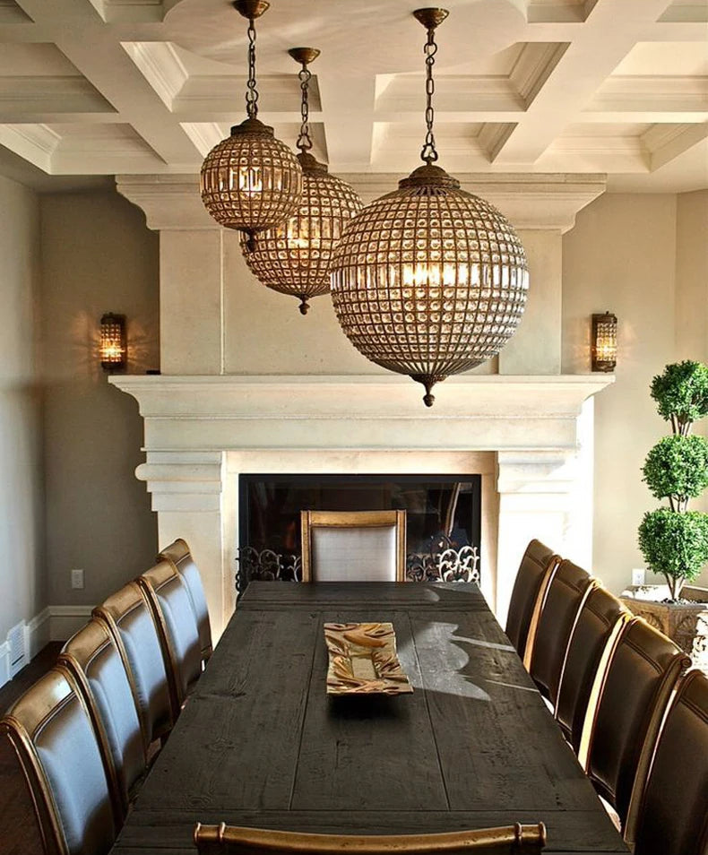 Set of Retro Crystal Chandeliers with LED lights above a long dining table, perfect for upscale dining room lighting.
