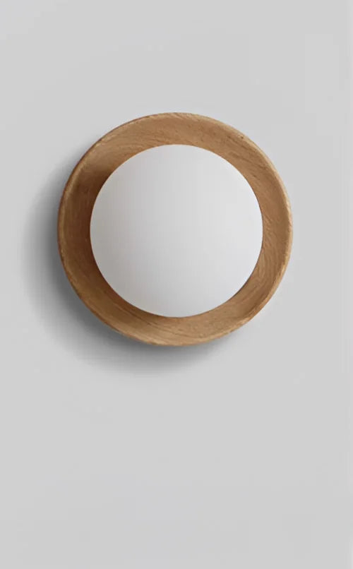 Minimalist light wood wall lamp with frosted globe, ideal for Scandinavian-inspired home lighting decor.