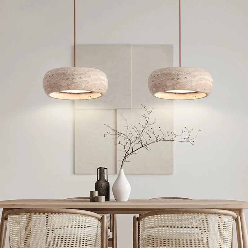Travertine Stone LED Pendant Light – Modern Fixture displayed in a minimalist dining area with two rounded pendant lights over a table.