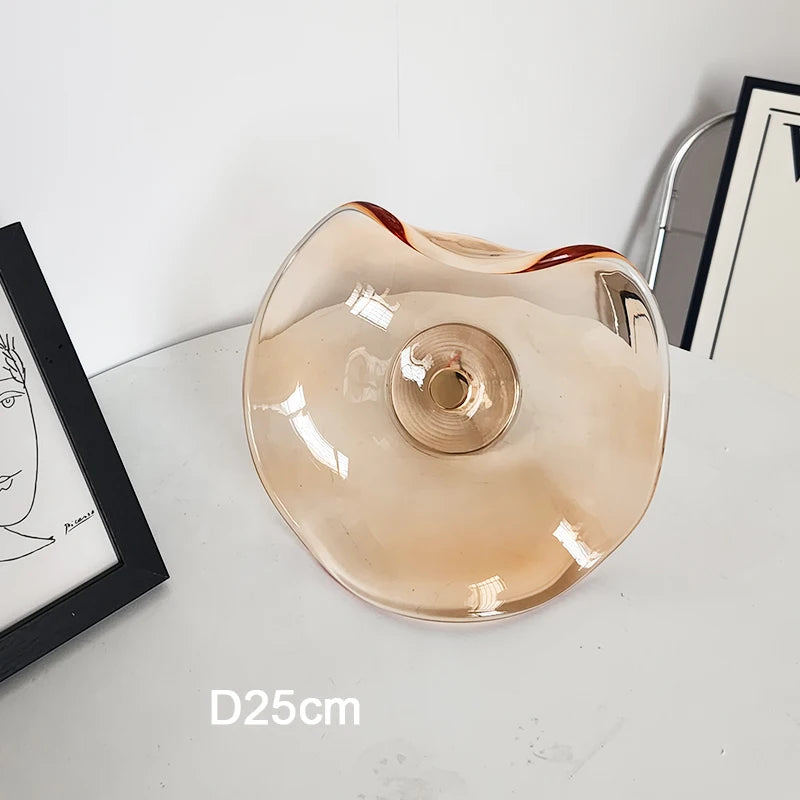 Amber glass modern wall lamp with 25cm diameter, featuring sculptural art deco form for stylish home or restaurant lighting.