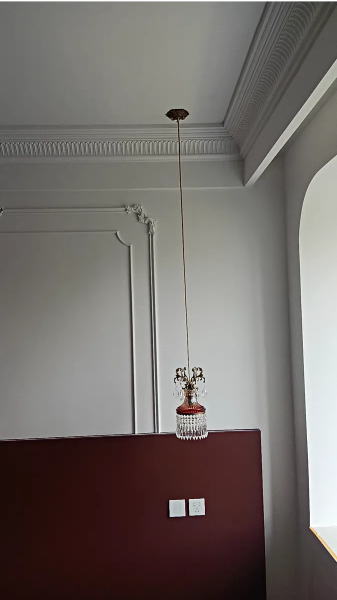 Tall ceiling installation of retro French crystal chandelier, luxury pendant light for classic architectural interiors.