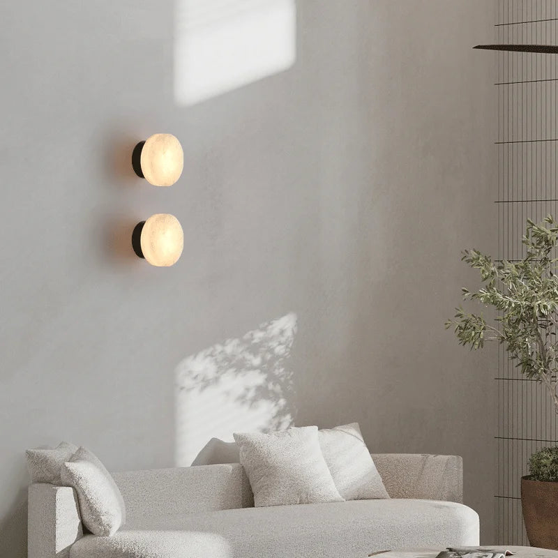 Pair of Modern LED Marble Wall Lamps mounted in a living room, adding elegant lighting and minimalist decor to the space.