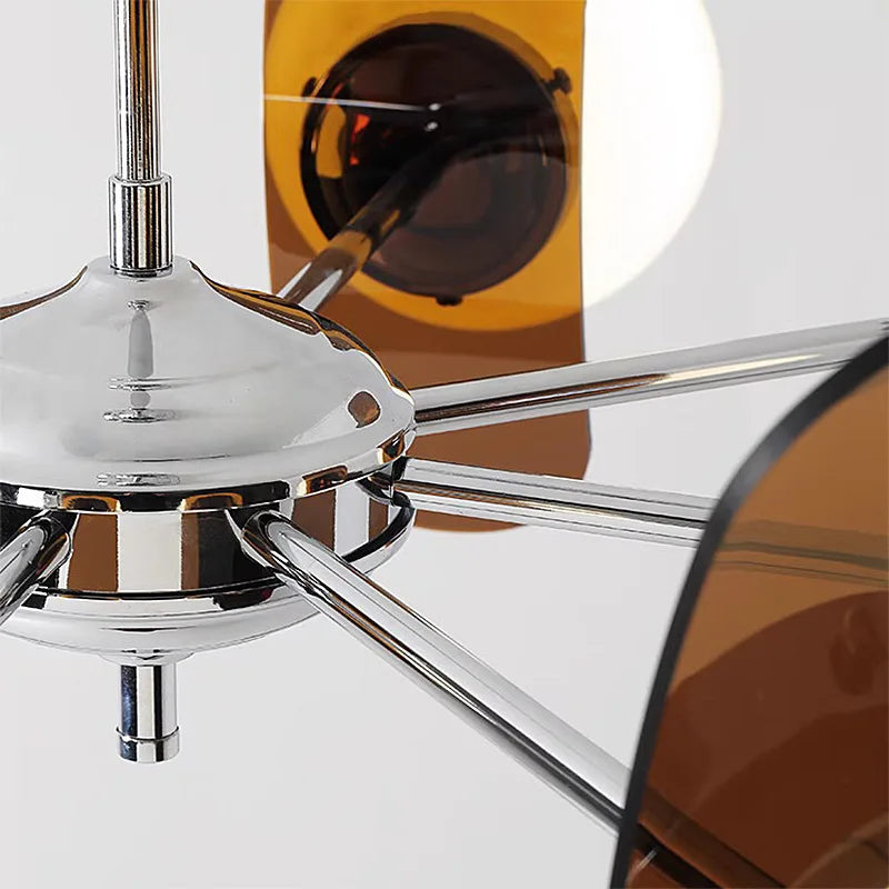 Close-up of chrome center and brown acrylic blades on Bauhaus retro chandelier, showcasing modern LED lighting design.