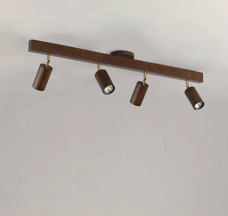 Four-head LUXELY wood grain LED spotlight on ceiling, ideal for modern and vintage-inspired home lighting solutions.