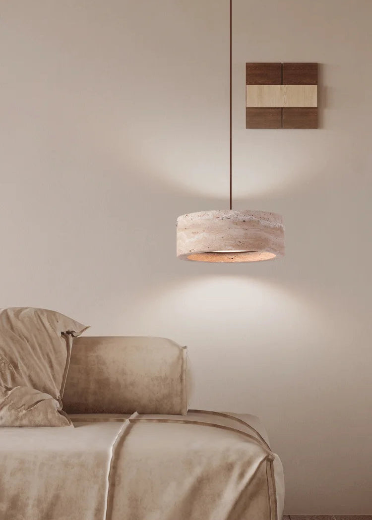 Travertine Retro Pendant Light in a beige-toned bedroom, offering ambient LED lighting with a natural stone finish and adjustable wire.