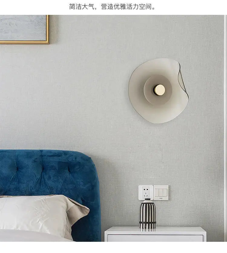 Glass modern wall lamp with round art deco design installed in a bedroom, offering elegant and energy-efficient wall lighting.