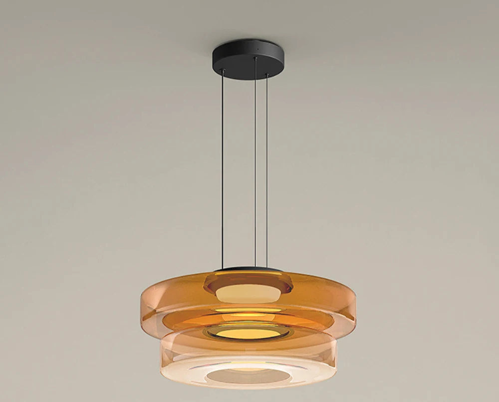 Amber two-tier glass pendant light with 45cm and 35cm diameters. Dimmable LED lighting for luxury kitchen or dining spaces.